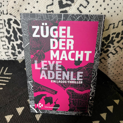 Detailansicht Buchcover Zügel der Macht – pinkes Stadtplan-Motiv, Leye Adenle, InterKontinental Verlag